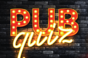 Pub-Quiz Schriftzug Halogenschriftzug "Pub-Quiz" vor schwarzer Backsteinwand